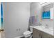Bathroom with a shower curtain, gray walls, and a modern vanity at 1526 Country Chase St, Lakeland, FL 33810
