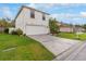 Two-story home with a spacious driveway, lush lawn, and well-manicured landscaping at 1526 Country Chase St, Lakeland, FL 33810
