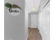 Neutral hallway with tile floors and white doors at 1526 Country Chase St, Lakeland, FL 33810