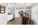 Bright kitchen with white cabinets, stainless steel appliances, and tiled floors at 1526 Country Chase St, Lakeland, FL 33810
