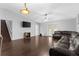 Open-concept living room with hardwood floors at 1526 Country Chase St, Lakeland, FL 33810