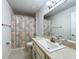 This bathroom provides a mirror, sink, toilet, and shower and is ready for all needs at 153 Heritage Park Ln, Mulberry, FL 33860