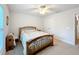 Comfortable bedroom includes carpet flooring, window, and a bed provides a peaceful retreat at 153 Heritage Park Ln, Mulberry, FL 33860