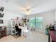 Versatile bedroom featuring carpeted floors, ceiling fan, and natural light from large windows at 153 Heritage Park Ln, Mulberry, FL 33860