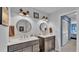 Bathroom featuring dual vanities with modern fixtures and a connecting door to the bedroom at 159 Coventry Cir, Haines City, FL 33844