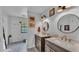 Bright bathroom features dual vanities, modern lighting, and stylish decor for a spa-like feel at 159 Coventry Cir, Haines City, FL 33844