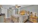 Comfortable bedroom featuring a ceiling fan, hardwood floors, a queen bed, and a neutral gray color scheme at 159 Coventry Cir, Haines City, FL 33844