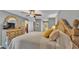Spacious bedroom featuring a ceiling fan, hardwood floors, a queen bed, and ample closet space at 159 Coventry Cir, Haines City, FL 33844