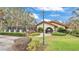 Community pool with exterior lamp post and plenty of shrubs at 159 Coventry Cir, Haines City, FL 33844
