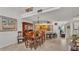 Open-concept dining area featuring wood table, ample seating and views of kitchen at 159 Coventry Cir, Haines City, FL 33844