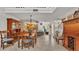 Dining area with tile floors and open floor plan to the kitchen and staircase at 159 Coventry Cir, Haines City, FL 33844