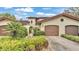 Charming Mediterranean home with a red tile roof and lush, well-manicured landscaping at 159 Coventry Cir, Haines City, FL 33844