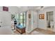Bright foyer with tile flooring, bench seating, and a large window for natural light at 159 Coventry Cir, Haines City, FL 33844