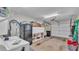 Spacious garage with storage shelves, laundry and direct access via garage door at 159 Coventry Cir, Haines City, FL 33844