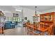 Open-concept floor plan with stylish living area adjacent to formal dining space at 159 Coventry Cir, Haines City, FL 33844