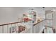 Upstairs loft overlooking the main floor, with a ceiling fan and comfortable seating at 159 Coventry Cir, Haines City, FL 33844