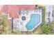 Aerial view of the screened pool and patio area offering ample space for dining and lounging at 159 Coventry Cir, Haines City, FL 33844