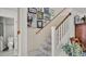 Stairway leading to upper level complemented by decorative wall art and wood handrail at 159 Coventry Cir, Haines City, FL 33844