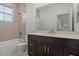 Stylish bathroom with a shower-tub combination, modern vanity, and neutral tile work at 168 Hampton Loop, Davenport, FL 33837