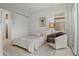 Cozy bedroom with a comfortable bed, stylish armchair, and ample natural light at 168 Hampton Loop, Davenport, FL 33837