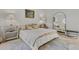 This bedroom features neutral walls, stylish nightstands and lamps, and a soft rug for added comfort at 168 Hampton Loop, Davenport, FL 33837