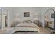 This bedroom features neutral walls, stylish nightstands and lamps, and a soft rug for added comfort at 168 Hampton Loop, Davenport, FL 33837