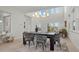 Dining room with a modern light fixture and an open-concept to living area at 168 Hampton Loop, Davenport, FL 33837