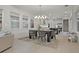 Dining area boasts natural light, views of the kitchen, and stylish décor at 168 Hampton Loop, Davenport, FL 33837
