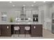 Kitchen with white cabinets, stainless steel appliances, and a center island with seating at 168 Hampton Loop, Davenport, FL 33837