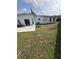 Spacious backyard with a large concrete patio and lawn at 1771 Bayview Dr, Lakeland, FL 33805