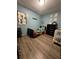 bedroom with a twin bed, crib, and blue-painted walls at 1771 Bayview Dr, Lakeland, FL 33805