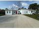 Charming one-story brick home with well-maintained landscaping and a spacious driveway at 1771 Bayview Dr, Lakeland, FL 33805
