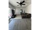 Comfortable living room with gray flooring and a sliding glass door at 1771 Bayview Dr, Lakeland, FL 33805