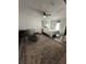 Cozy main bedroom with a king bed, crib, recliner, and decorative rug at 1771 Bayview Dr, Lakeland, FL 33805