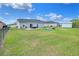 Exterior backyard view with a brick patio, outdoor furniture, swing set, and shed that offers space for outdoor enjoyment at 1784 Williamsburg Dr, Bartow, FL 33830