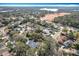 Overhead view of a charming residential area near a lake, showcasing serene living and natural beauty at 21 Townhill Dr, Eustis, FL 32726
