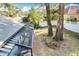 A screened-in room adds living space, while a mature yard with a privacy fence completes this backyard at 21 Townhill Dr, Eustis, FL 32726