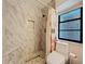 Bathroom featuring marble tile in shower at 21 Townhill Dr, Eustis, FL 32726