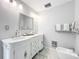 Bright and airy bathroom with double vanity, marble countertops and accents, bidet, and luxurious towels at 21 Townhill Dr, Eustis, FL 32726
