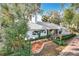 Charming home with a freshly landscaped front yard, accented by vibrant foliage and a pristine exterior at 21 Townhill Dr, Eustis, FL 32726