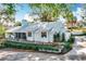 Single-story house boasts a pristine lawn, fenced yard, and freshly painted exterior, radiating curb appeal at 21 Townhill Dr, Eustis, FL 32726