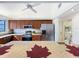 Kitchen with stainless steel appliances, stone countertops, and ample cabinet space for culinary enthusiasts at 21 Townhill Dr, Eustis, FL 32726
