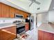 Well-equipped kitchen featuring stainless steel appliances, granite countertops, and ample wood cabinetry at 21 Townhill Dr, Eustis, FL 32726