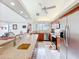 Open-concept kitchen featuring stainless steel appliances, granite countertops, and seamlessly connecting to the living space at 21 Townhill Dr, Eustis, FL 32726