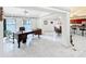Open floor plan living space with tile floors, office space, kitchen and a dining area at 21 Townhill Dr, Eustis, FL 32726