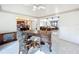 Open floor plan living space featuring an office area, kitchen and a spacious seating area, and tile floors at 21 Townhill Dr, Eustis, FL 32726
