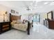 Main bedroom features tile floors, a ceiling fan, and private backyard access, providing a serene retreat at 21 Townhill Dr, Eustis, FL 32726
