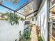 Enclosed outdoor patio with ample natural light and green plants at 21 Townhill Dr, Eustis, FL 32726