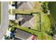 Private backyard with views of the lake, surrounded by lush greenery and neighborhood charm at 2443 Torrens Dr, Lakeland, FL 33805