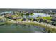 Waterfront community showcasing beautiful homes with lush landscaping and scenic lake views at 2443 Torrens Dr, Lakeland, FL 33805